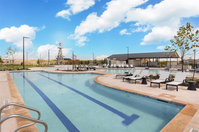 view of swimming pool featuring a patio area