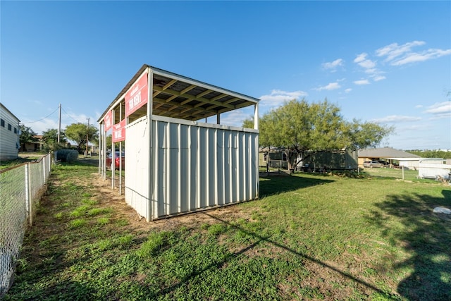 view of outdoor structure with a yard