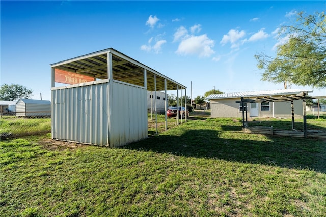 view of shed / structure with a lawn