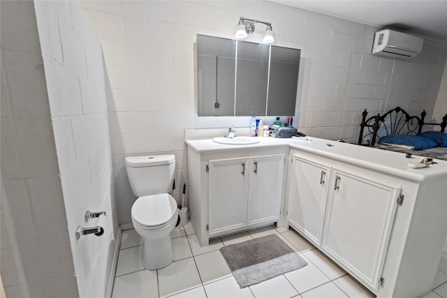 bathroom featuring tile walls, a wall mounted air conditioner, tile floors, and vanity