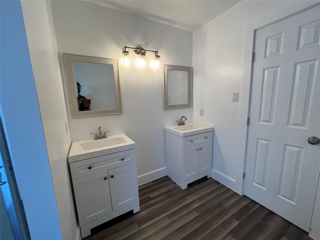 bathroom with hardwood / wood-style flooring and vanity