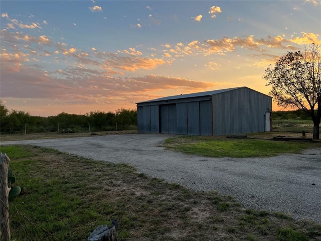 view of outdoor structure at dusk