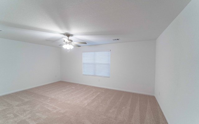 empty room with carpet and ceiling fan