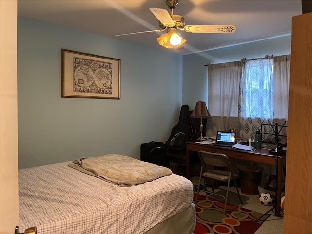 carpeted bedroom featuring ceiling fan