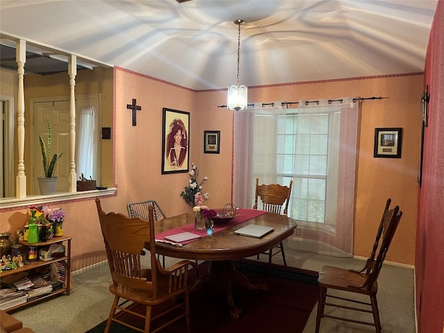 dining room with carpet flooring and lofted ceiling