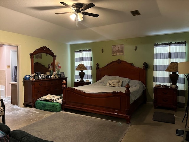 bedroom featuring ceiling fan and connected bathroom