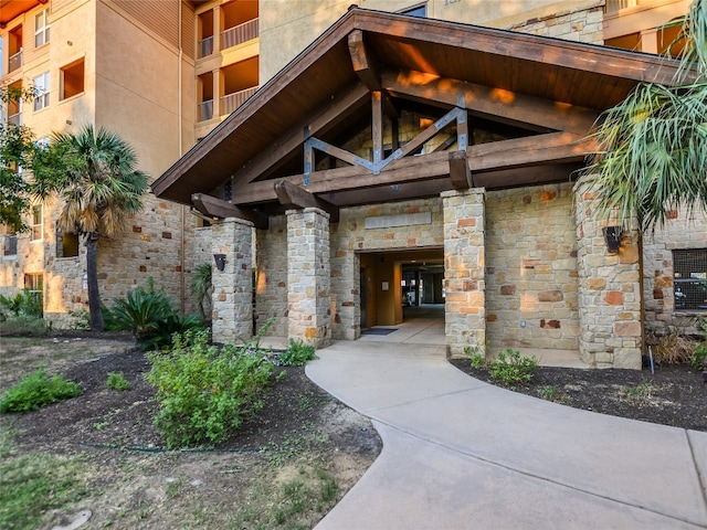 property entrance with a balcony