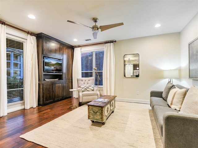 living room with hardwood / wood-style floors and ceiling fan