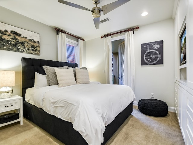 carpeted bedroom featuring ceiling fan