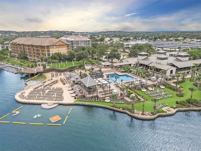 birds eye view of property with a water view