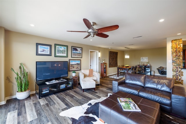 living room featuring ceiling fan and hardwood / wood-style floors