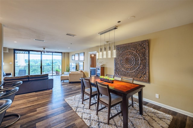 dining space featuring dark wood-type flooring