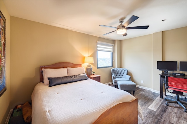 bedroom featuring dark hardwood / wood-style floors and ceiling fan