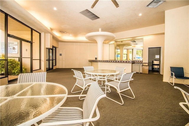 view of carpeted dining area