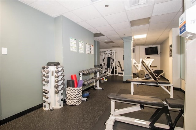 workout area featuring a drop ceiling