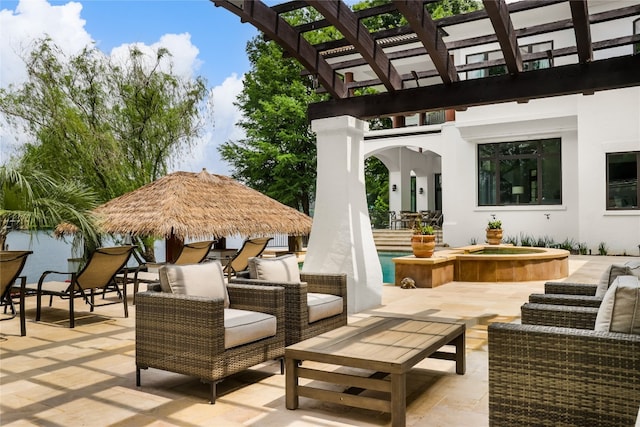 view of patio / terrace with outdoor lounge area, a pergola, and an in ground hot tub