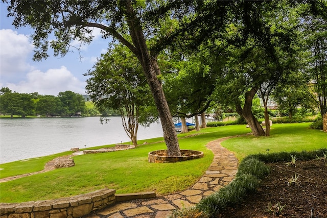 exterior space featuring a water view and a yard