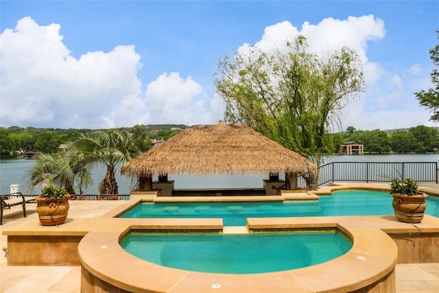 view of pool with an in ground hot tub and a patio area