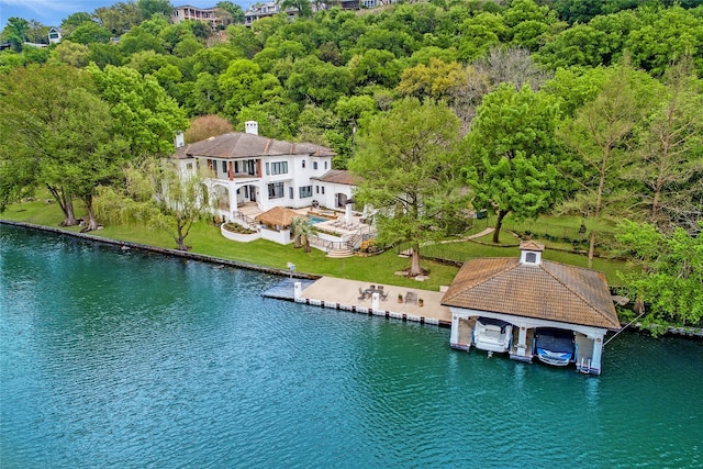 birds eye view of property with a water view