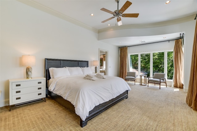 bedroom featuring crown molding, ceiling fan, and light colored carpet