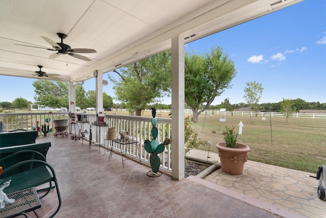 view of patio featuring ceiling fan