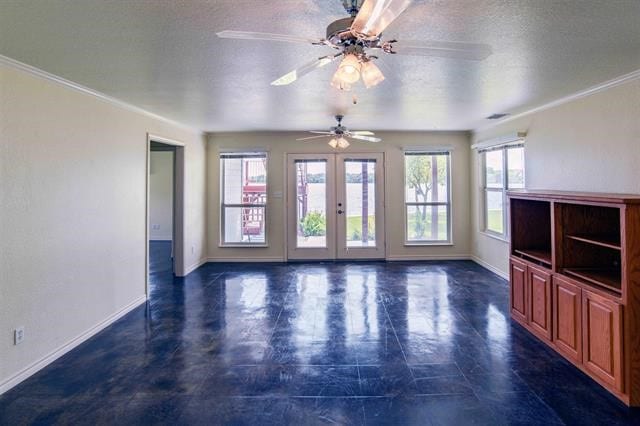 unfurnished living room with plenty of natural light, a textured ceiling, ceiling fan, and french doors