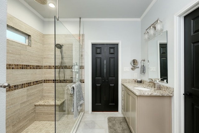 bathroom with vanity, tile flooring, crown molding, and a shower with shower door