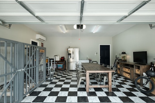 garage with stainless steel fridge, a garage door opener, and a wall unit AC