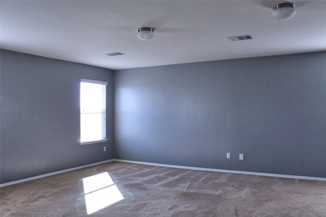 empty room featuring carpet flooring