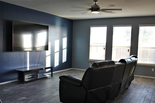 living room with ceiling fan and dark wood-type flooring