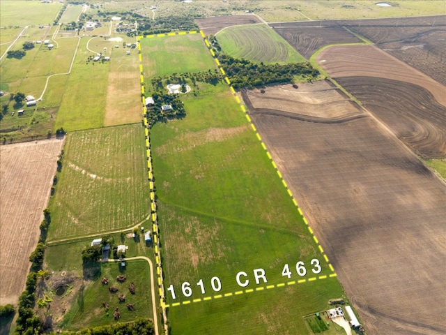 birds eye view of property with a rural view