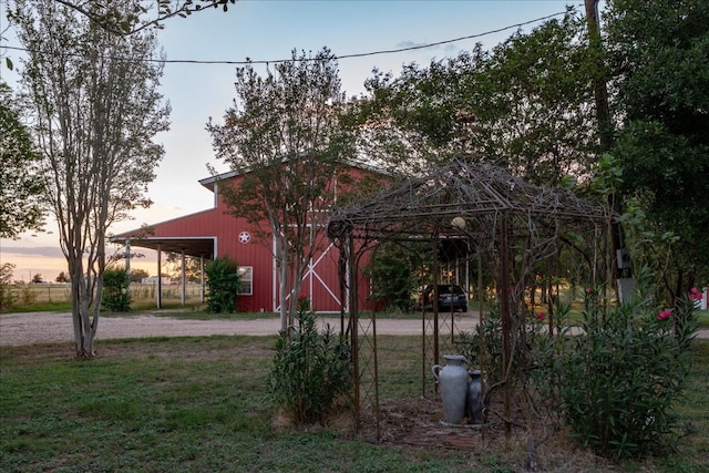 yard at dusk with an outbuilding