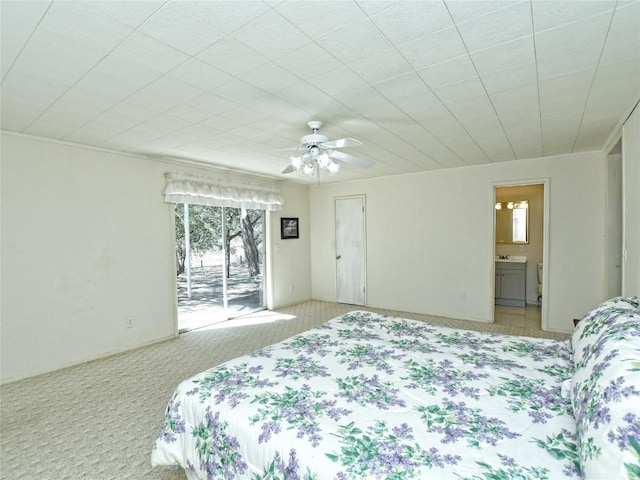 carpeted bedroom featuring access to outside, ensuite bath, and ceiling fan