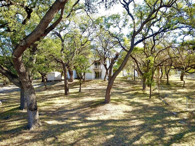 view of yard featuring a balcony