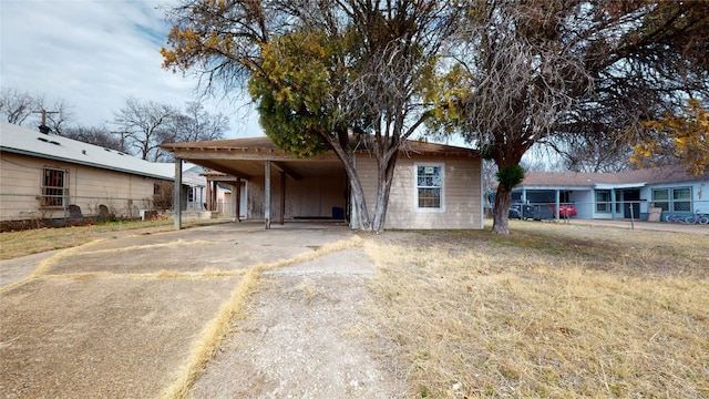 single story home featuring a carport