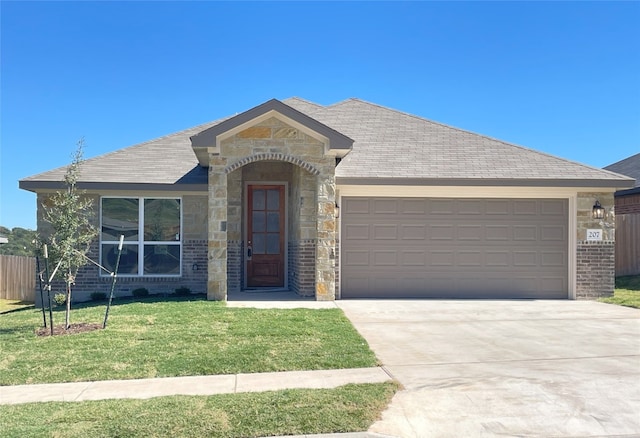 ranch-style house featuring a front lawn and a garage