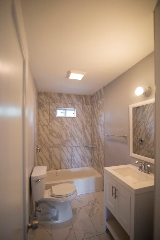 full bathroom with tiled shower / bath combo, tile floors, vanity with extensive cabinet space, and toilet