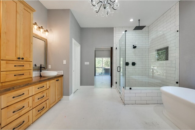 bathroom with independent shower and bath, dual sinks, a notable chandelier, and oversized vanity