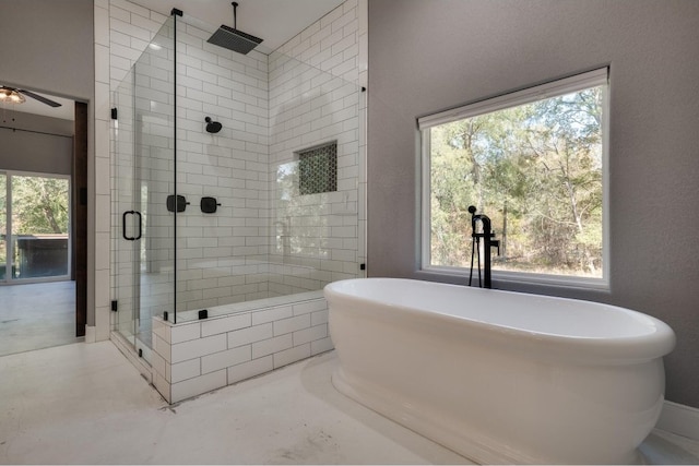 bathroom with ceiling fan, a healthy amount of sunlight, and separate shower and tub