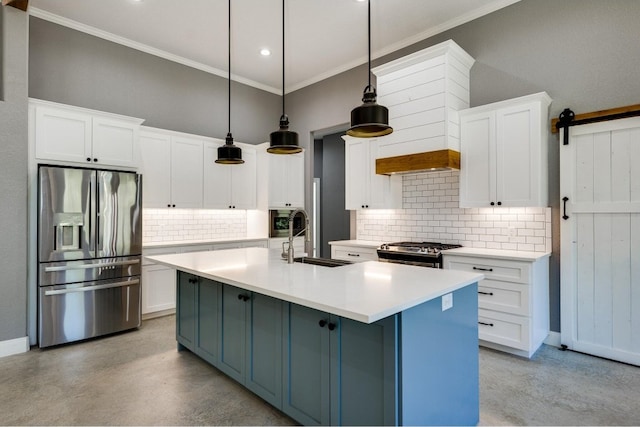 kitchen featuring tasteful backsplash, decorative light fixtures, appliances with stainless steel finishes, and sink