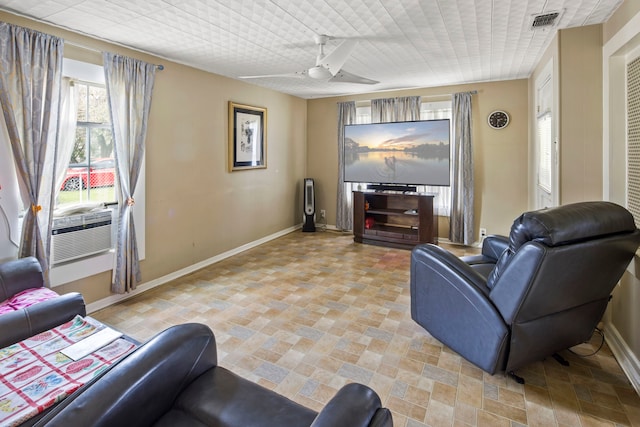 living room featuring cooling unit and ceiling fan