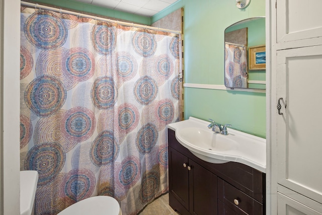 bathroom featuring vanity and toilet