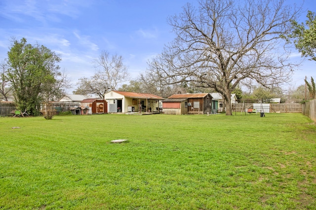 view of yard featuring a storage unit