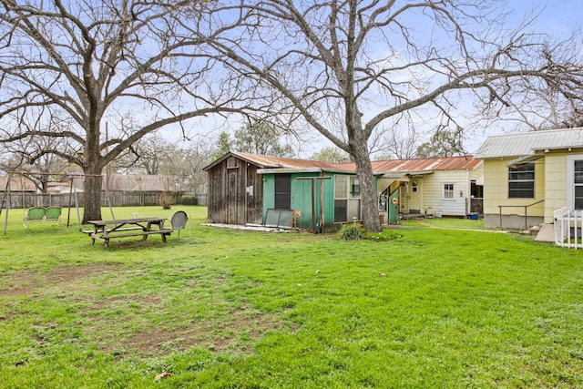 rear view of house with a yard