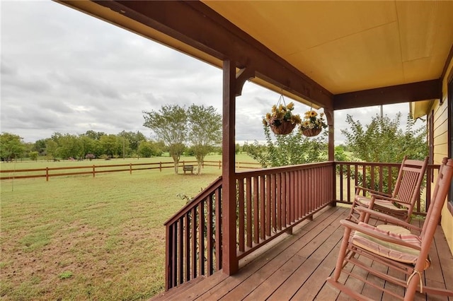 wooden deck featuring a yard