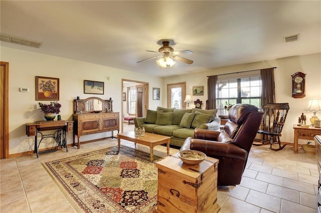 living room featuring ceiling fan and light tile floors