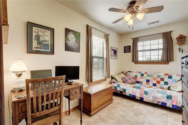 tiled bedroom with ceiling fan