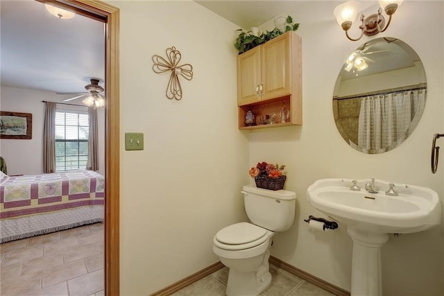 bathroom with toilet, tile flooring, and ceiling fan