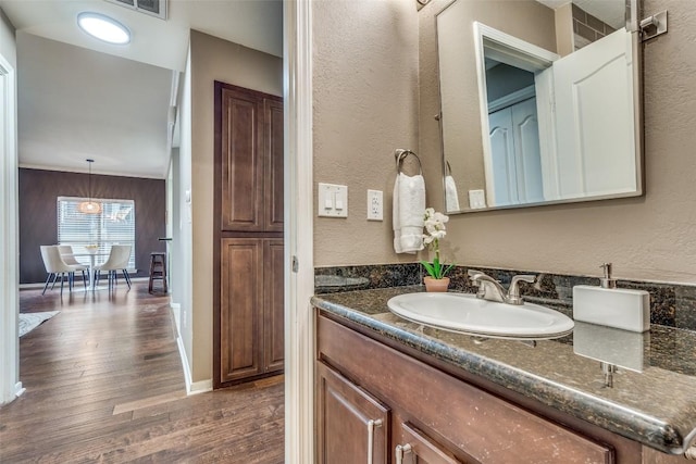 bathroom featuring hardwood / wood-style floors and vanity