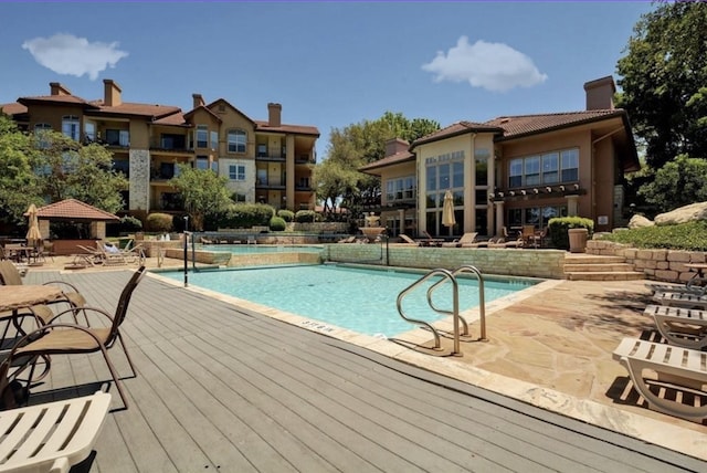 view of swimming pool with a gazebo and a patio